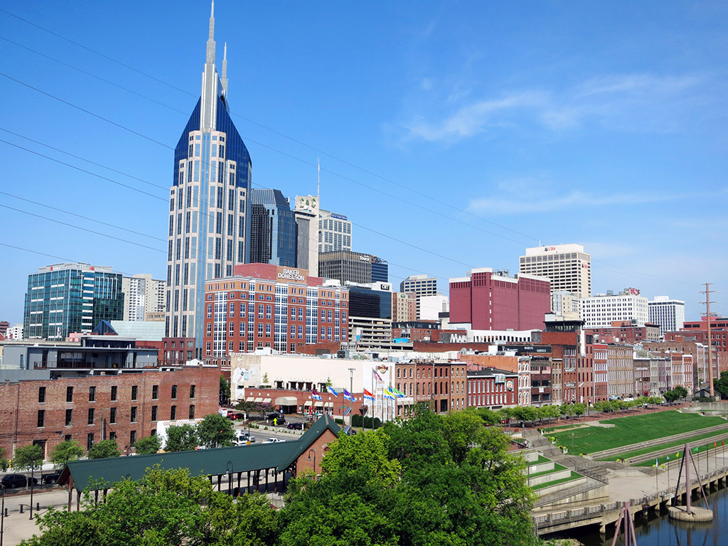 The Nashville skyline as seen from the pedestrian bridge crossing the Cumberland River. The green space near the river often features live music and is one of the best places to watch the Fourth of July fireworks display, the largest in the South. Photo by Trisha Ping