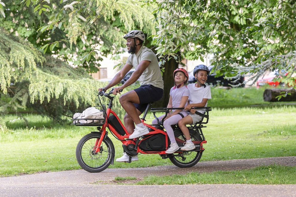 Tern Quick Haul Long cargo bike with rider and two kids